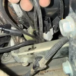 Exhaust temperature sensor plugs on Kubota SVL95-2 with V3800 engine