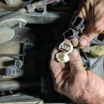 Disconnected temperature sensor connectors on Kubota SVL95-2 V3800