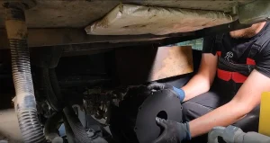 Straight pipe being installed on a Yanmar ViO80 excavator during DPF delete kit installation
